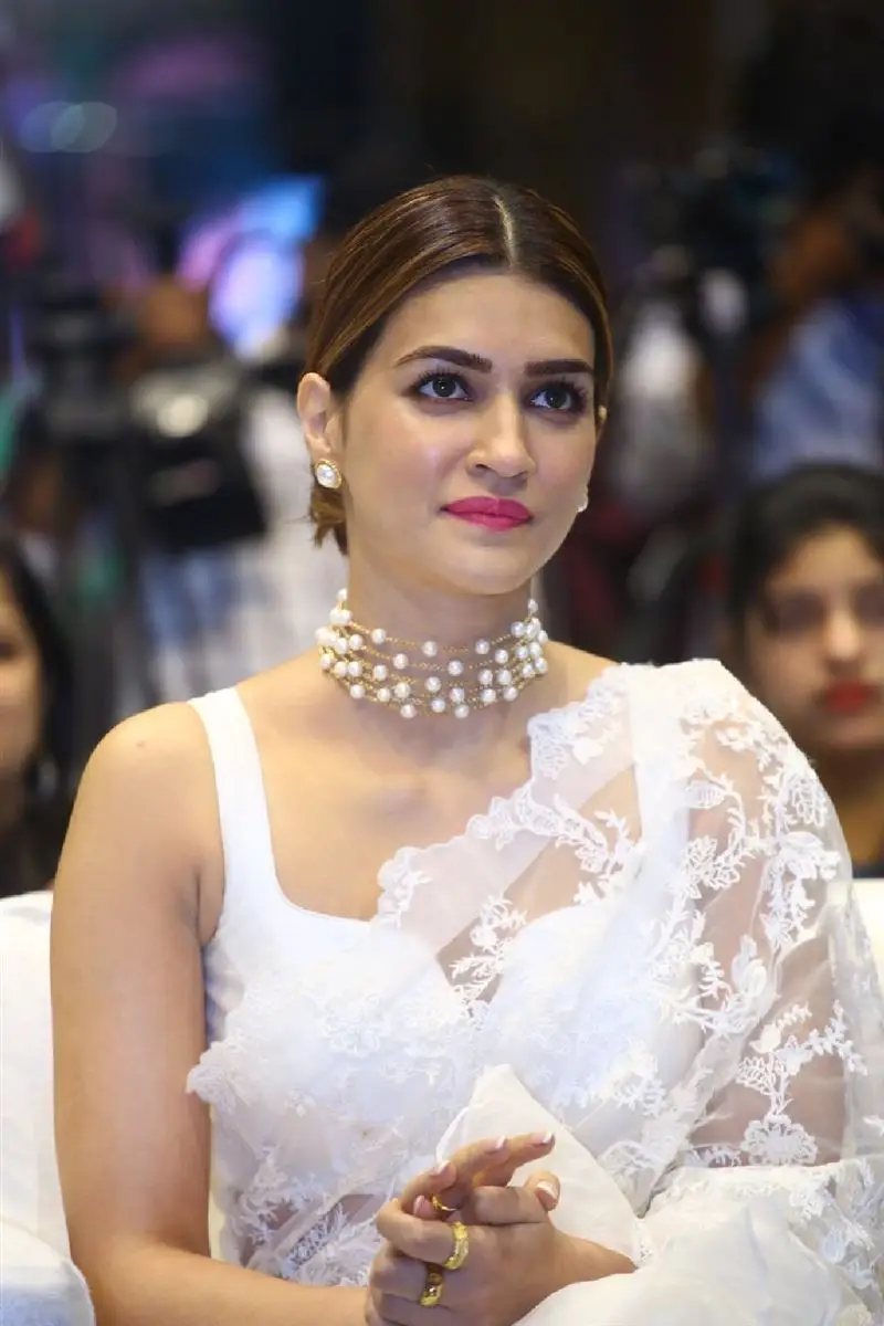 Kriti Sanon Charming Stills In White Saree Sleeveless Blouse